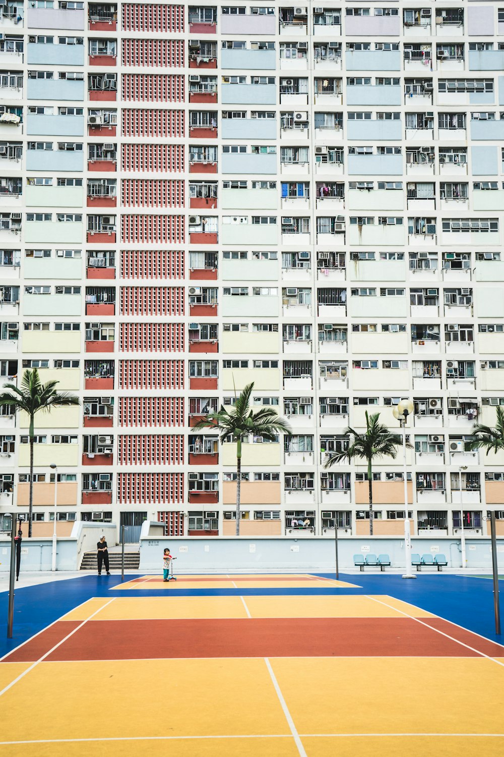 white wall paint high-rise building during daytime