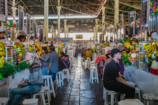 A vibrant street market in the Dominican Republic with colorful fruits and busy locals.