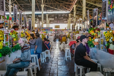 Colorful local market scene with tropical fruits and vibrant fabrics in Guadeloupe