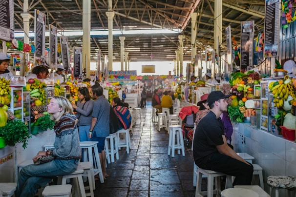A vibrant local market scene with fresh Honduran fruits and vegetables displayed.