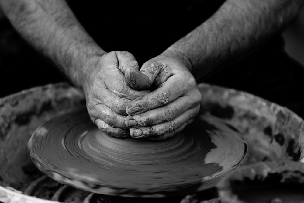 person making pot