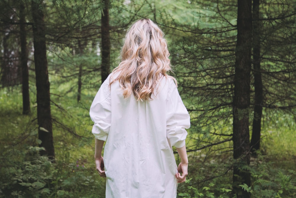 woman on white top in forest