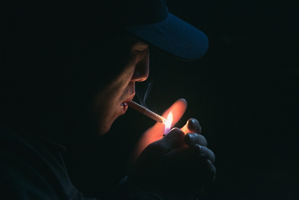 man lighting his cigarette