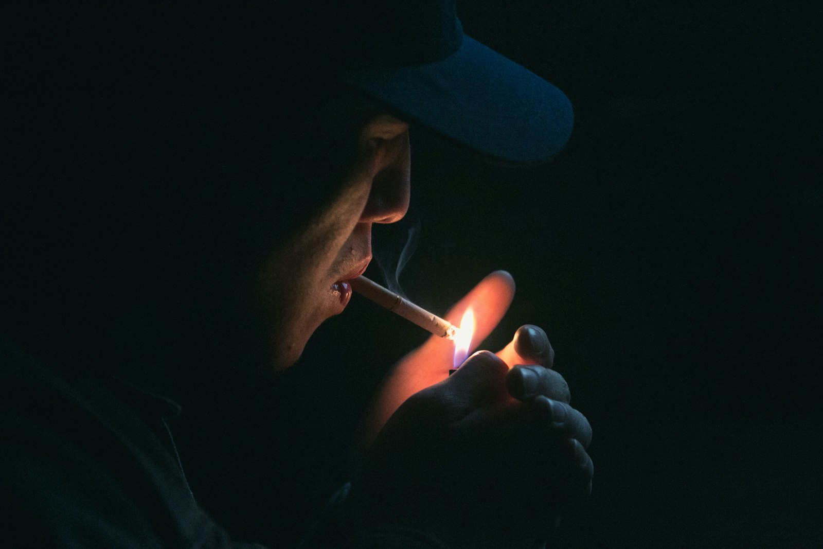 Canon EOS 70D sample photo. Man lighting his cigarette photography