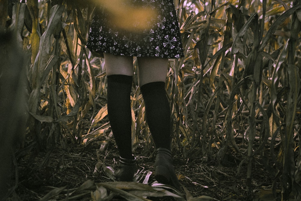 person wearing black skirt close-up photography