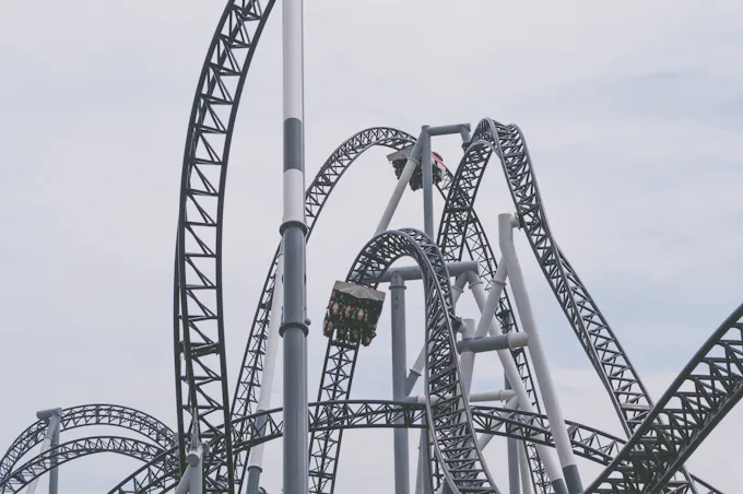 Roller coaster under blue sky, similar to Leap-the-Dips, the historic wooden coaster at Lakemont Park in Lakemont, PA