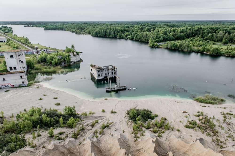 white concrete building in body of water