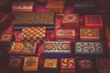 A display of hand-carved wooden boxes with detailed floral patterns.