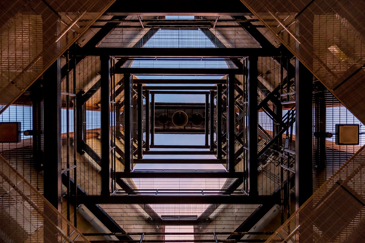 A building framework from the perspective of standing in the middle of the building looking upward.