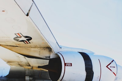 white and red airliner plane wing google meet background