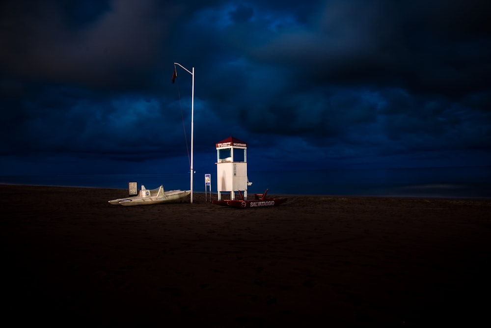 white shed under black sky