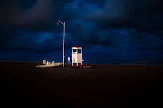 white shed under black sky