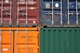 several cargo containers riding on trucks with lorry tyres sold at our tire shop in nigeria