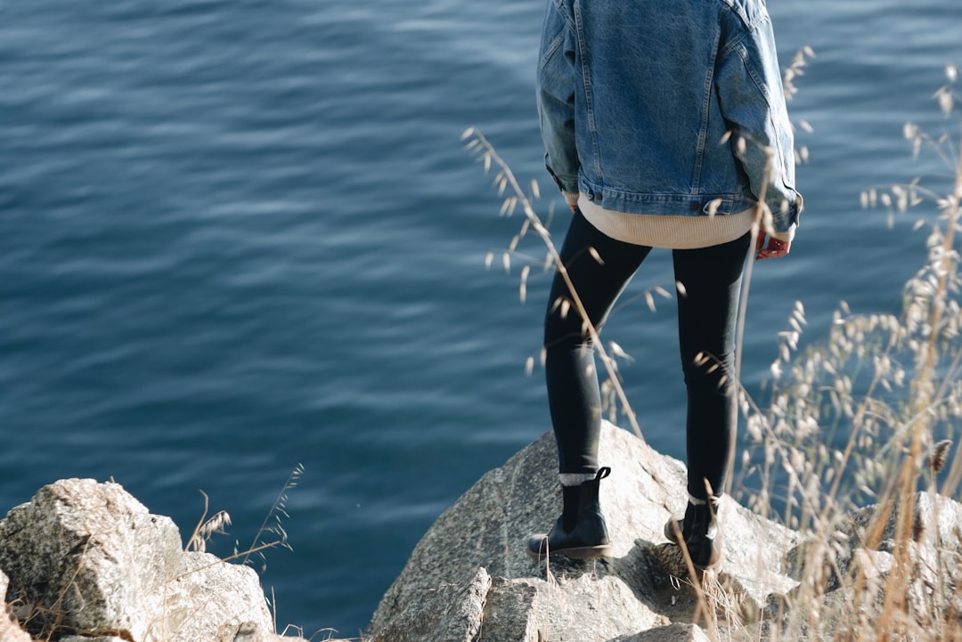 woman standing on cliff