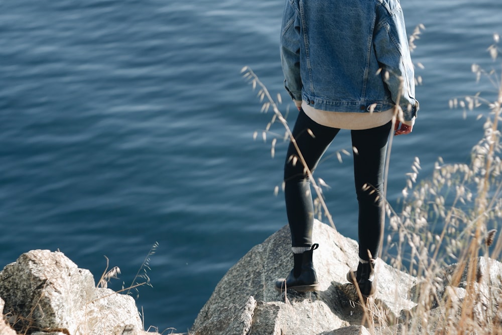 woman standing on cliff