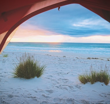 pink tent near white sand near sea tuscany vacanza mare