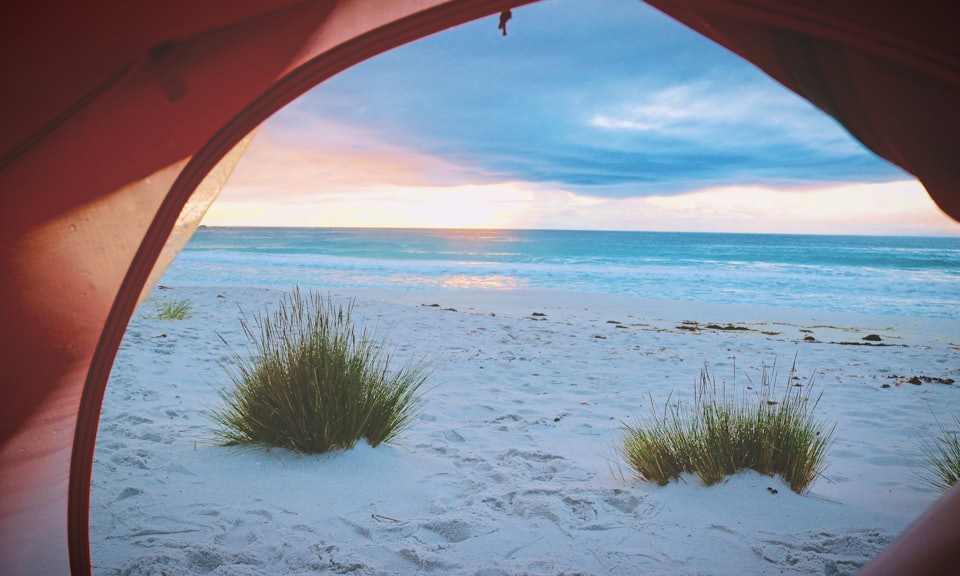 pink tent near white sand near sea tuscany vacanza mare