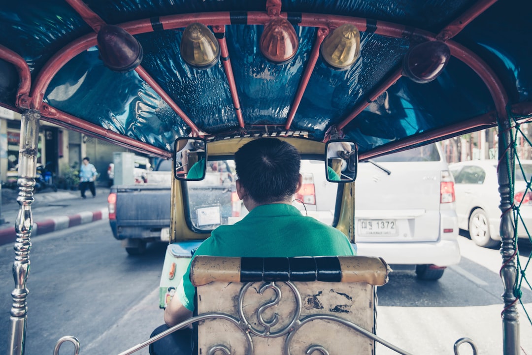 man driving rickshaw