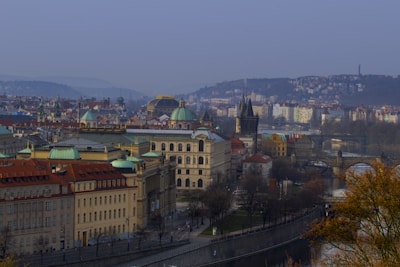 A scenic European city skyline with historic university buildings in the background.