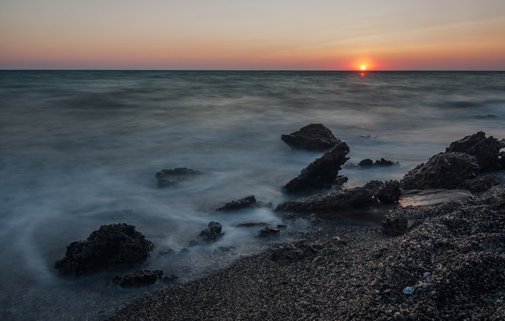 landscape photography of body of water during golden hour