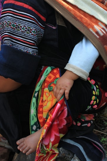 Close-up of soft, colorful fabrics showcasing matching patterns for parents and kids.