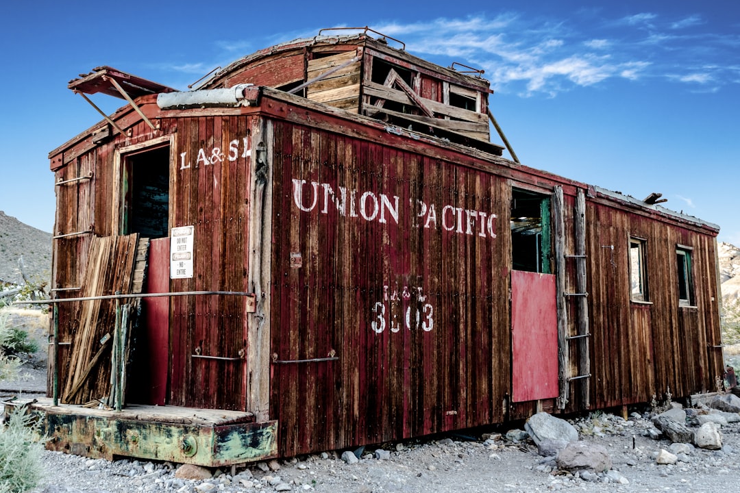 brown containerized housing unit, derelict train carriage