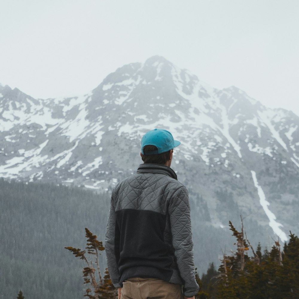 man in gray and black zip-up jacket