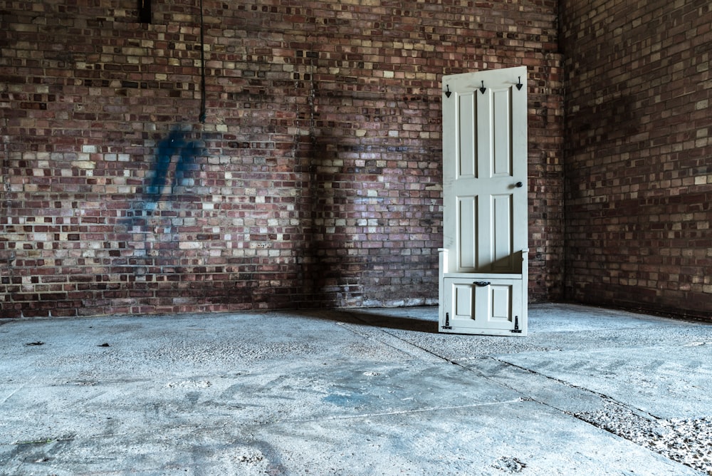 white wooden 6-panel door in room