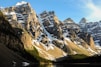 snow capped mountain near body of water