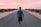 man walking on gray concrete road