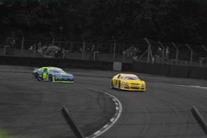 Action shot of two RC cars neck and neck, sparks flying as they race side by side