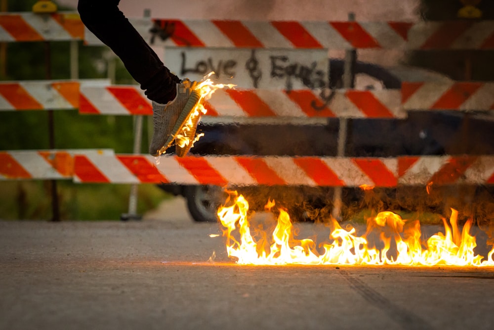 person jumping from fire