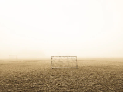 soccer goal on brown field