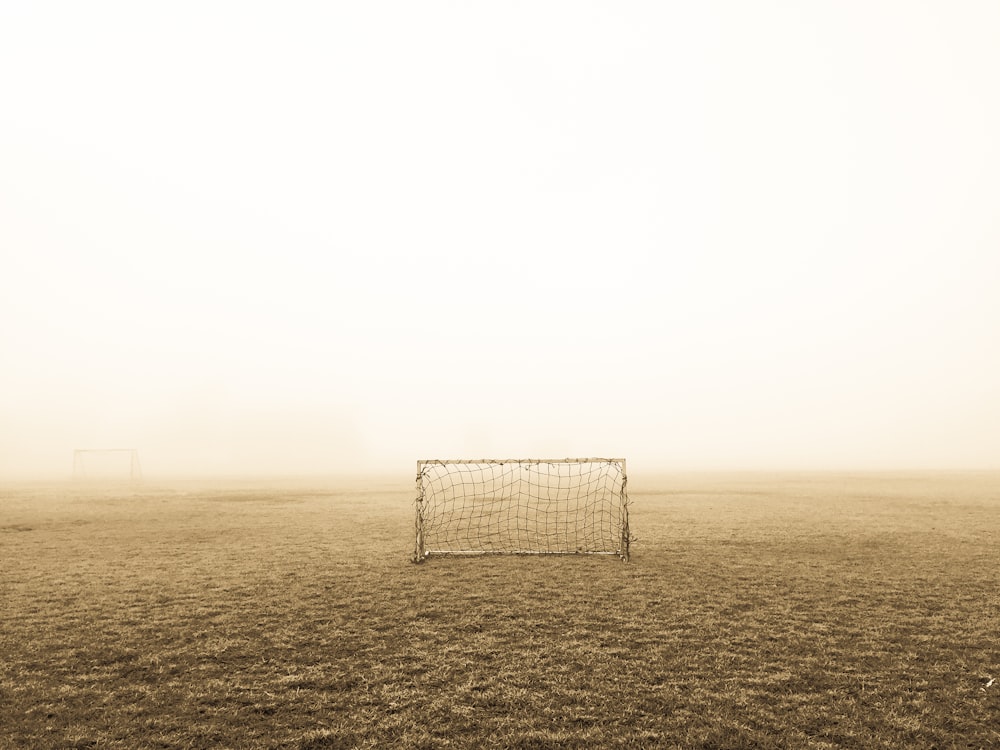 soccer goal on brown field