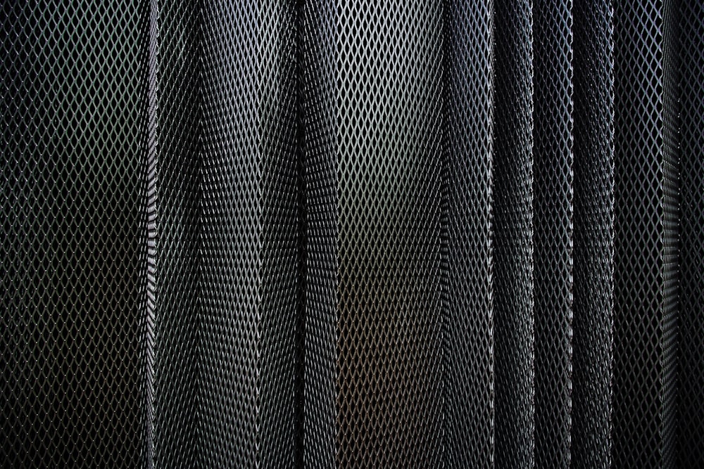 A metal criss-cross grid in undulating layers