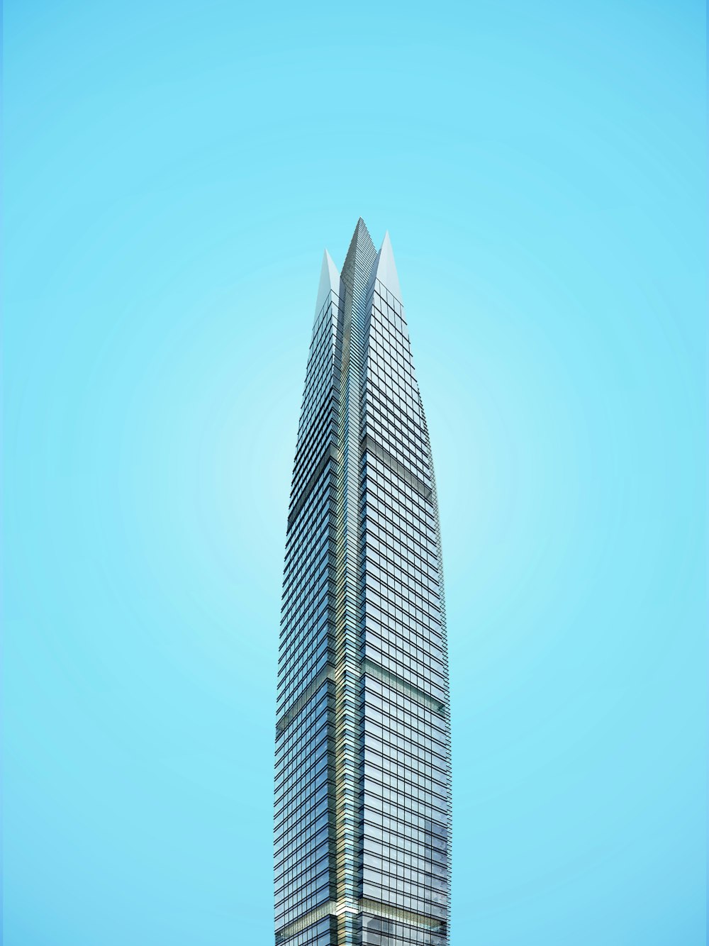 Immeuble de grande hauteur gris sous ciel bleu