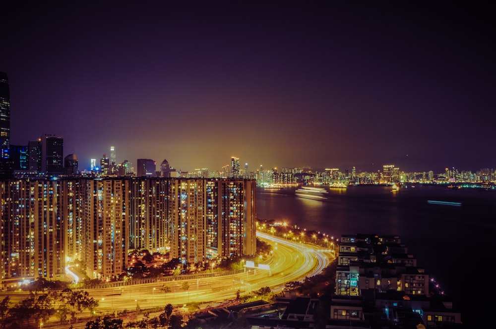 photo of high rise buildings near body of water