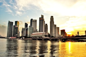 A skyline view of Batam or Jakarta at sunset, symbolizing growth.