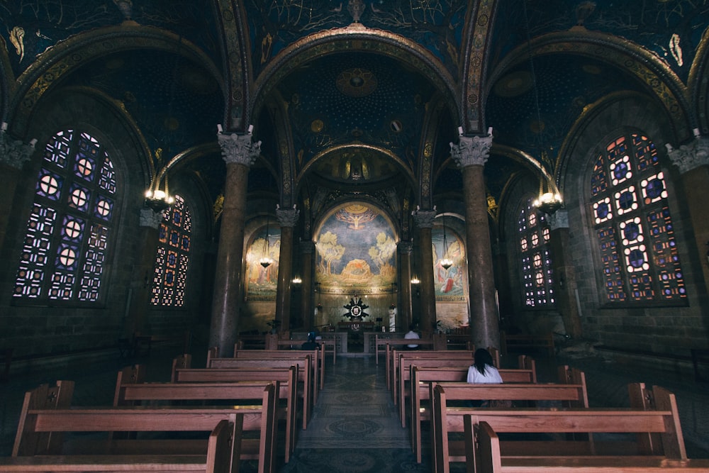 few people sitting inside church