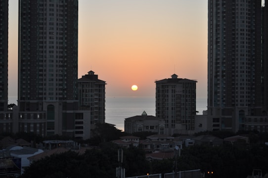 Sunset view of sleek Brickell high-rise condos overlooking Miami Bay.