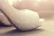 Close-up of elegant blush pink heels with subtle gold accents on a soft ivory background.