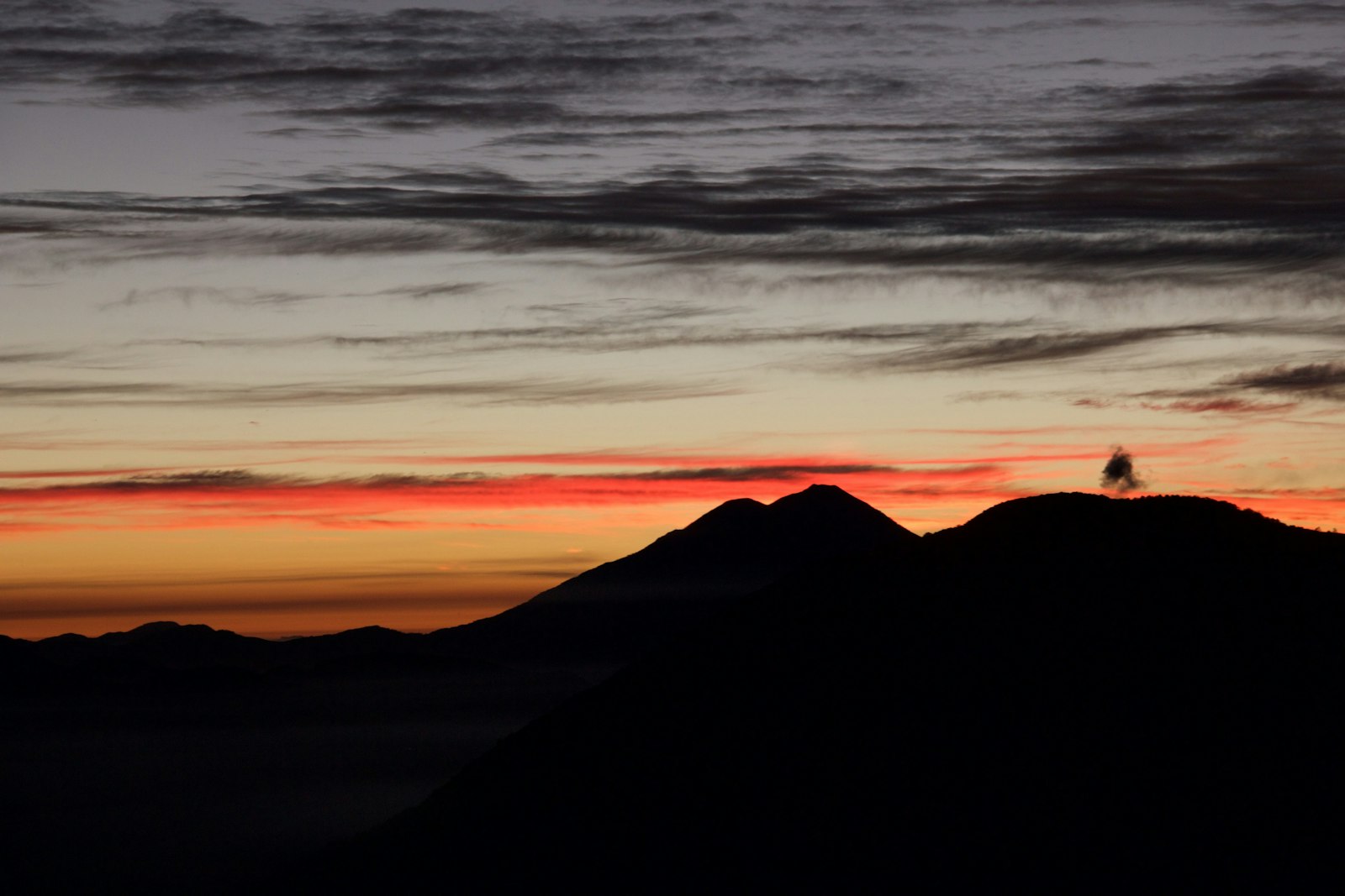 Canon EOS 550D (EOS Rebel T2i / EOS Kiss X4) + Canon EF-S 18-135mm F3.5-5.6 IS sample photo. Silhouette of mountain against photography