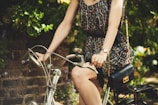 woman riding on commuter bike during daytime