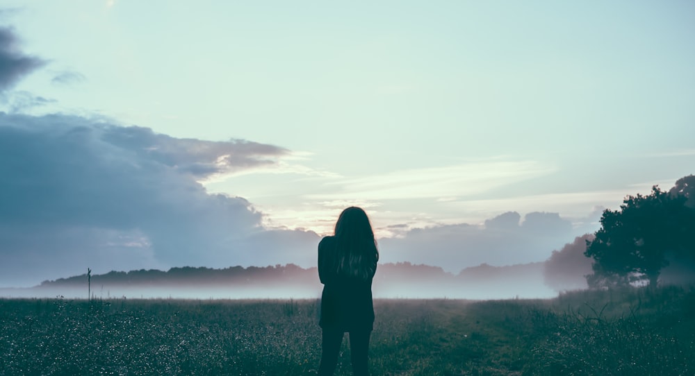 woman standing field silhouette