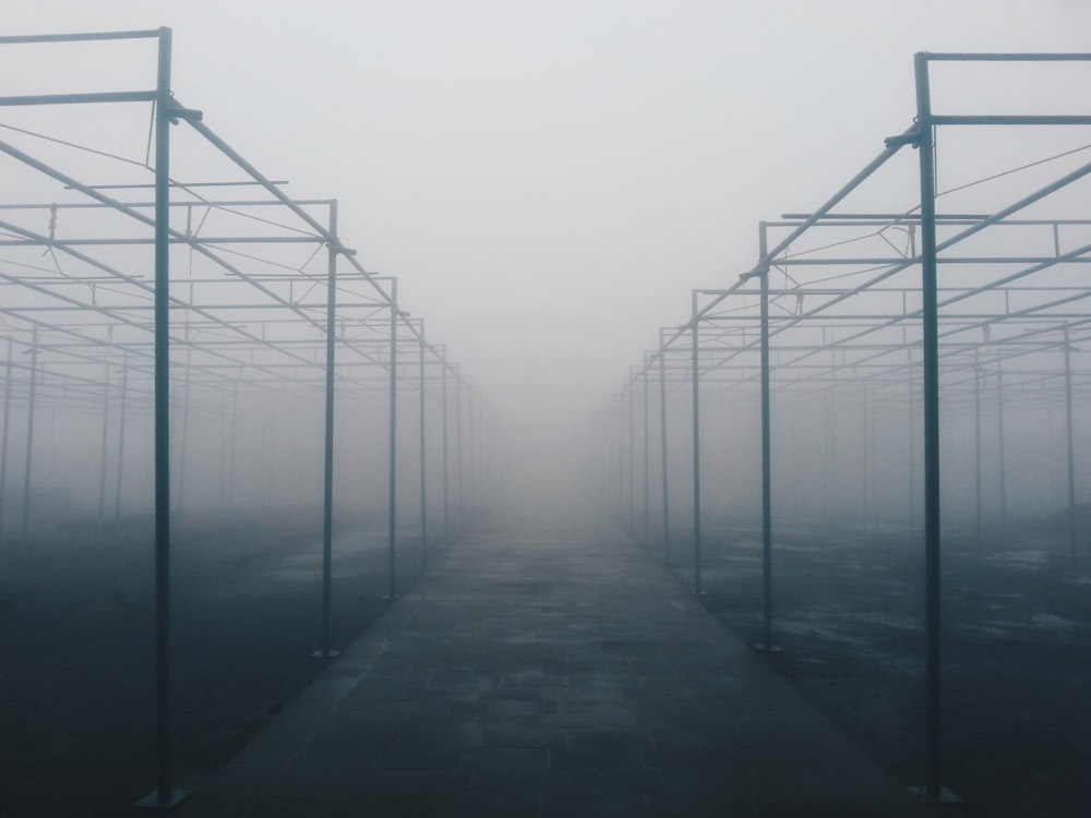 architectural photography of foggy metal building frames