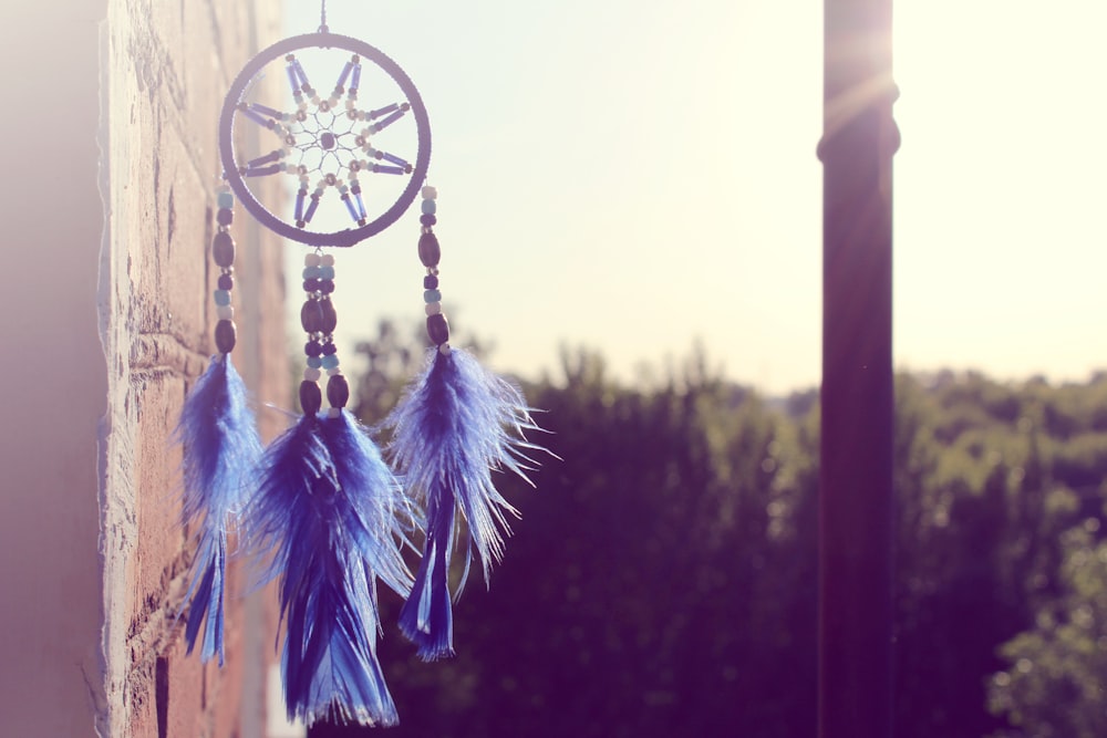 selective focus of hanging blue and black dream catcher