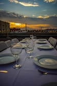 A beautifully set outdoor dining table with iconic São Paulo cityscape in the background.