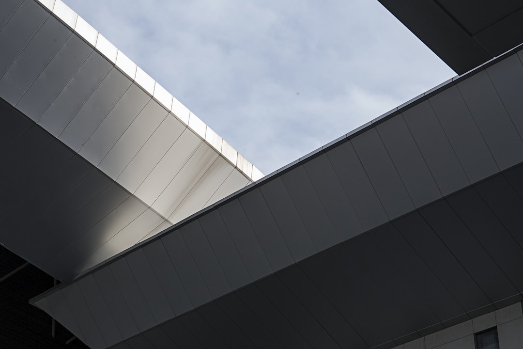 architectural photography of gray concrete building, Skylight in industrial ceiling