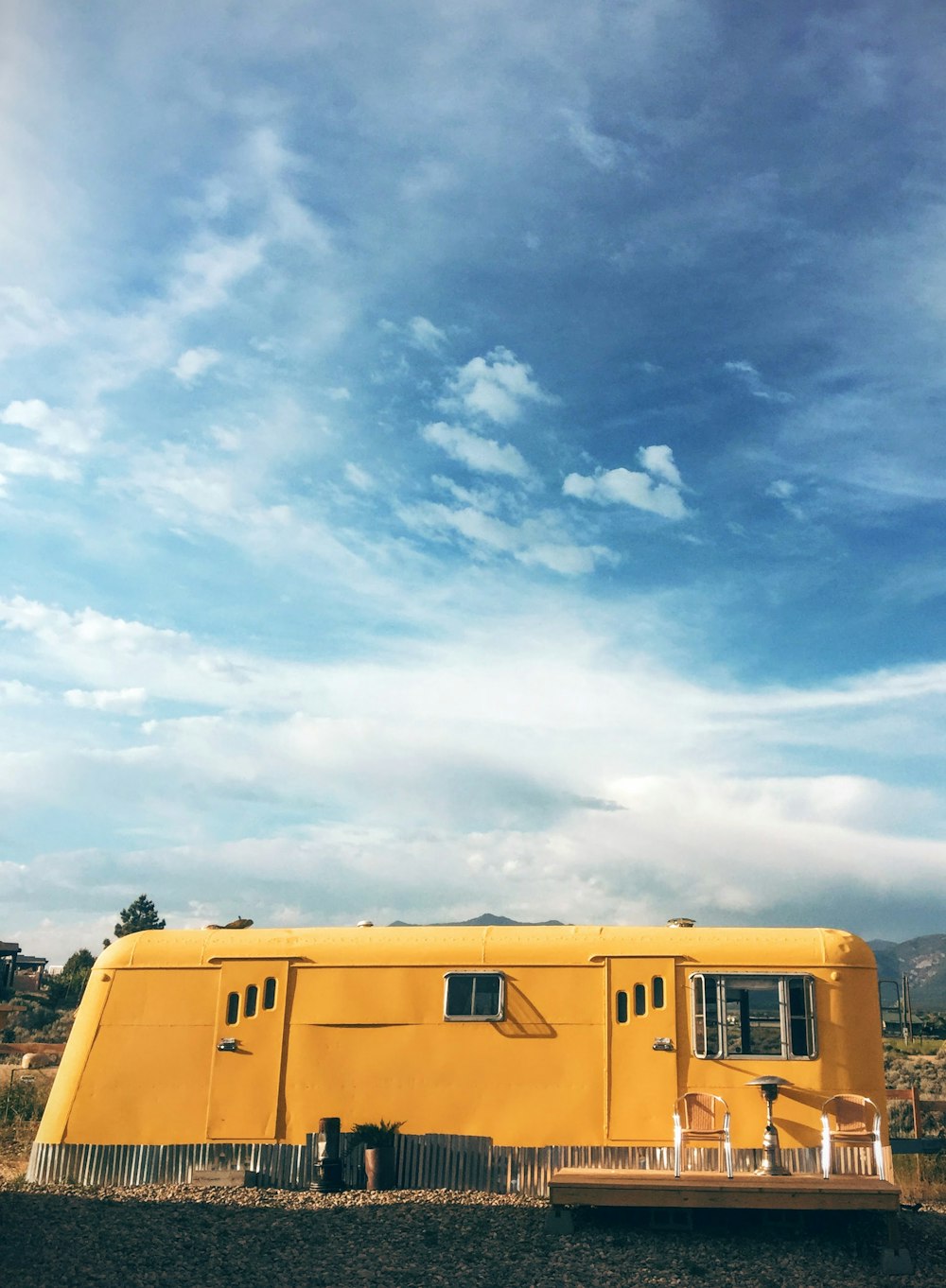 yellow bus under blue sky