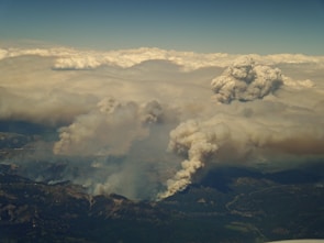 Satellite view showing real-time wildfire spread with data overlays.